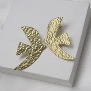 Gold textured bird earrings, vintage designer style metal ear studs for women daily wear.