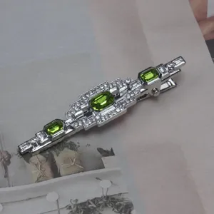 Vintage französischer Art-Déco-Haarclip mit funkelnden grünen Kristallen und Strass.