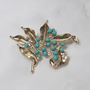 Vintage gold-tone leaf turquoise bead rhinestone brooch jewelry detail view pin.