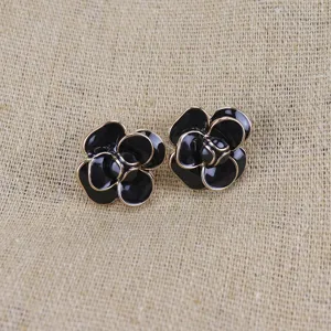 Black camellia flower stud earrings with gold trim, vintage enamel drop glaze jewelry.