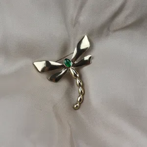 Retro enamel alloy dragonfly brooch detail, featuring a green stone accent for vintage style apparel.