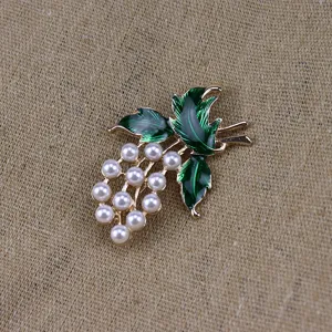 Pearl green enamel grape brooch detail shot showing exquisite vintage plant design craftsmanship.