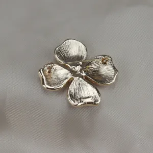 Vintage gold metal four leaf clover flower brooch back detail view jewelry accessory