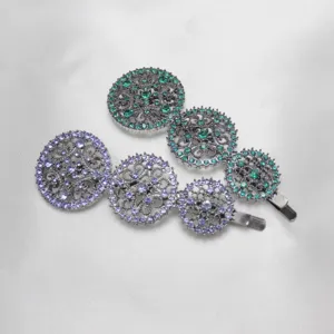 Close-up detail view of the sparkling rhinestone hollow round metal hair clips.