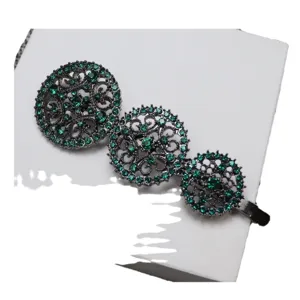 Vintage green rhinestone hair clip with triple round filigree design for elegant women styling.