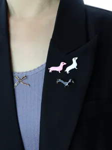 Detailed shot of cute dachshund enamel brooch pin set, lovely dog design for clothing and bags.
