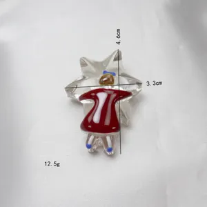 Niche design glass star hugging girl red dress bow brooch detail view showing size and weight