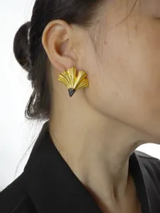 Ginkgo leaf earring detail shot, matte gold metal finish with black crystal pavé accent.