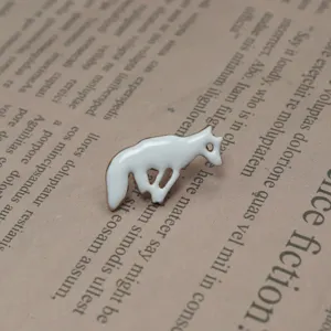 Cute white fox enamel pin detail close-up, premium metal alloy and glossy finish for bags hats.