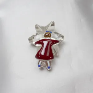 Handmade glass brooch featuring a girl hugging a star with red dress and cute bow.