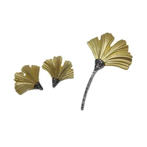 Vintage matte gold ginkgo leaf brooch and earrings set with sparkling black rhinestones.