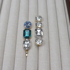 Crystal hair clip detail, featuring sparkling mixed-cut rhinestones in gold-tone setting.