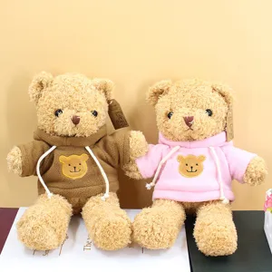 Adorable plush teddy bear stuffed animal wearing a cozy hoodie with cute chest embroidery.