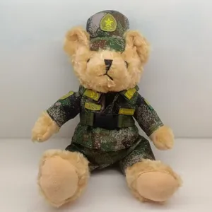 Detailed view of the military camouflage teddy bear plush toy wearing a uniform hat.