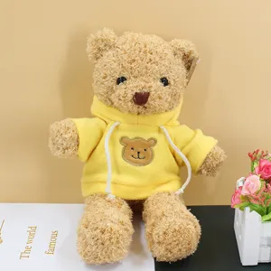 Cute teddy bear plush toy wearing yellow hoodie, soft stuffed animal doll for kids birthday gifts.