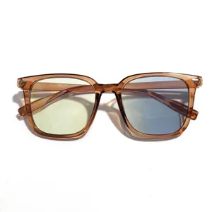 Close-up detail of anti-blue light glasses featuring a transparent brown frame and lenses.