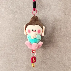 Close-up detail shot of the cute Yungang Grottoes Buddha plush pendant, soft texture and charms.