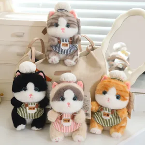 Cute plush cat keychain with chef hat and striped apron, soft stuffed animal doll detail.
