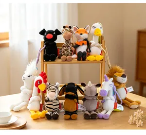 Cute angry animal plush keychain detail view, soft cartoon doll pendant for bags and keys.