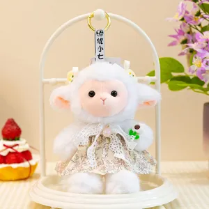 Cute white plush sheep doll plushie pendant wearing a floral dress, detailed closeup shot.
