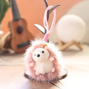 Cute pink plush hedgehog keychain cute cartoon bag charm fluffy toy pendant for keys daily use.