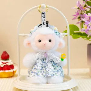 Cute white plush lamb toy detail, featuring fluffy fleece, blue floral dress and delicate lace.