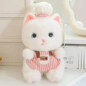 Cute white plush cat toy pendant wearing chef hat and pink striped apron, detailed view.