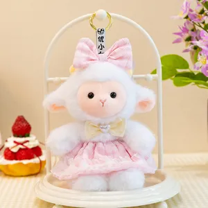 Cute plush sheep toy doll with pink dress and bow, soft stuffed animal keychain pendant for kids.