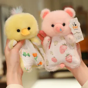 Close-up detail of cute cartoon plush toys, soft chick and pink pig dolls with printed outfits.