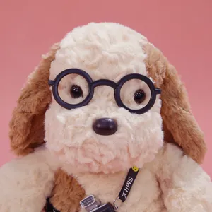 Cute plush puppy toy with round glasses, soft stuffed animal doll perfect for gifts.