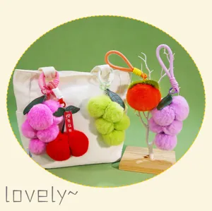 Cute fluffy plush fruit keychains candy color pompom bag charms for keys and handbags.