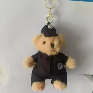 Cute police uniform teddy bear plush keychain, detailed view of soft toy pendant.