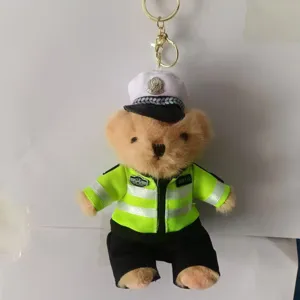 Traffic police teddy bear plush toy keychain detail, cute uniform design bag accessory.