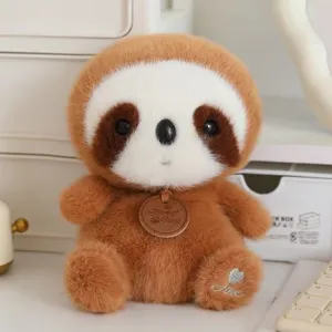 Close-up detail of cute brown plush toy with wooden tag and heart embroidery on the soft foot.
