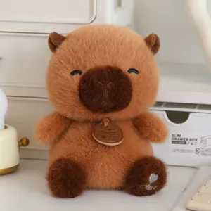 Cute brown plush toy doll, soft stuffed capybara animal figure with neck tag for home decor.
