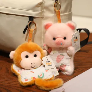 Cute plush toy pendant, adorable monkey and pig dolls with backpack, soft stuffed animal charms.