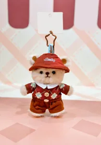Cute chocolate brown plush bear doll pendant, wearing cute checkered cardigan outfit, fluffy.