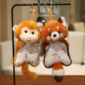 Cute plush animal keychain featuring monkey and red panda designs with soft fabric accents for bags.
