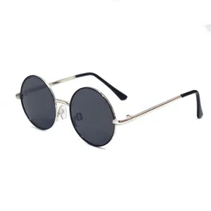Classic round metal frame sunglasses with black lenses for kids outdoor wear UV protection detail.