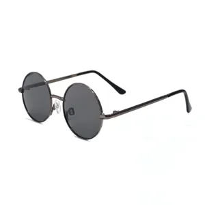 Round metal frame children sunglasses detail view with dark polarized lenses and thin temples.