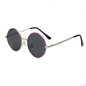 Close-up detail of round metal children sunglasses with purple rim and UV protection lenses.