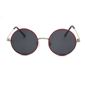 Detailed view of children round metal sunglasses with red rim and polarized lenses for kids.