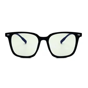 Detailed shot of black oversized anti-blue light glasses with metal rivet frame accents.