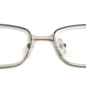 Detailed close-up product view of metal reading glasses bridge and clear silicone nose pads.