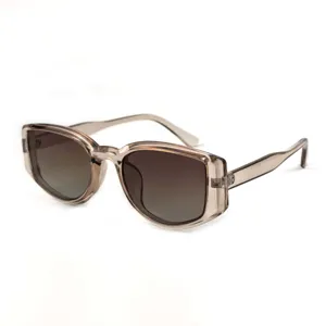 Detailed view of trendy women's translucent grey retro polarized sunglasses close-up.