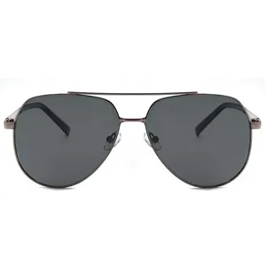 Metal frame aviator sunglasses detail shot, featuring polarized dark gray lenses and double bridge.