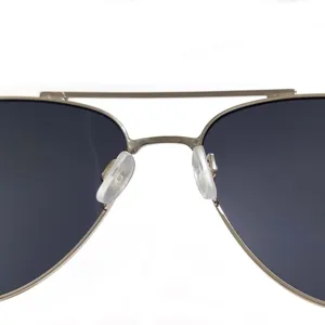 Close-up detail of metal aviator sunglasses double bridge and nose pads design.