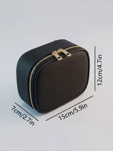 Black portable waterproof makeup storage bag with gold double zippers for daily travel use.