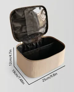 Detailed view of the cosmetic makeup bag showing transparent interior compartment and brush slots.