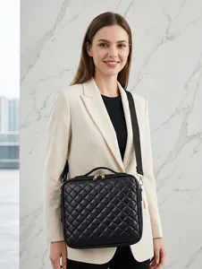 Black quilted cosmetic bag with handle and shoulder strap, elegant design for travel daily use.